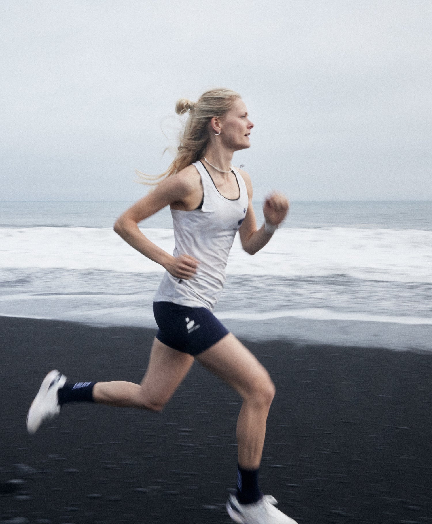 KARHU X SAYSKY WOMEN'S RUNNING SINGLET ON ICELAND BEACH